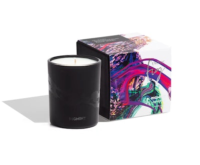 Fig scented candle in black vassel, next to the decorative box it comes in