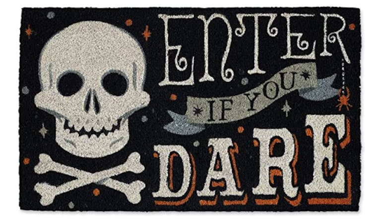 These Halloween doormats include spooky skulls.