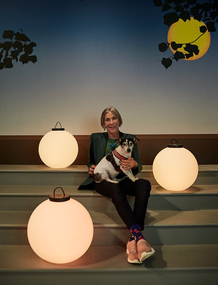 Alice Walton and her dog, Friday Walton, with lanterns inspired by Maxfield Parrish’s The Lantern Be...
