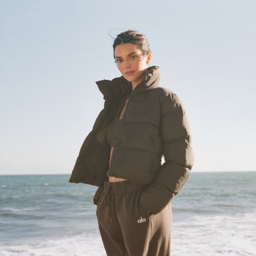 Kendall Jenner wears a cropped puffer jacket from Alo Yoga in her latest campaign, released on Octob...