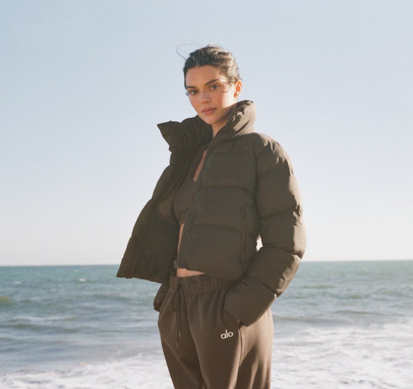 Kendall Jenner wears a cropped puffer jacket from Alo Yoga in her latest campaign, released on Octob...