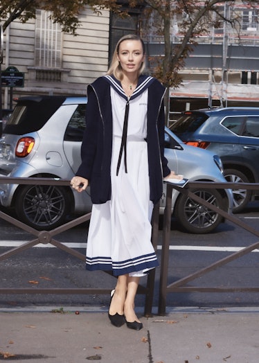 Nataly Osmann in sailor dress outside the Miu Miu spring 2022 show at Paris Fashion Week.