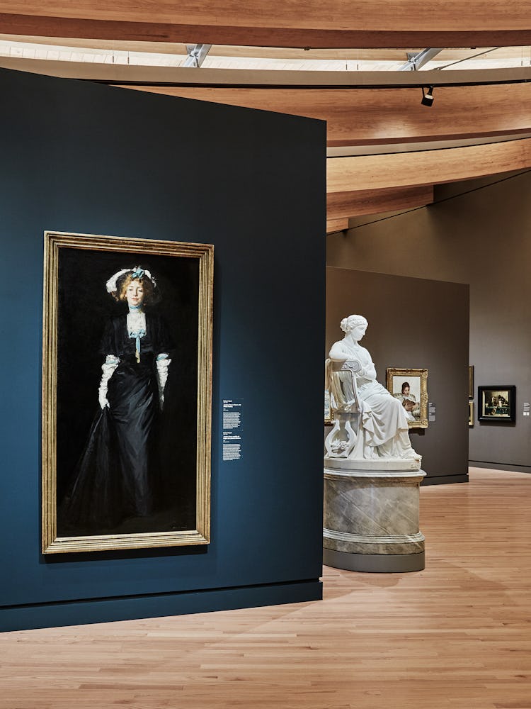 Robert Henri’s Jessica Penn in Black With White Plumes (left), 1908, on display with William Wetmore...
