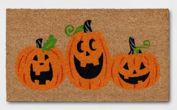 These Halloween doormats include a classic trio of Jack-O-Lanterns.