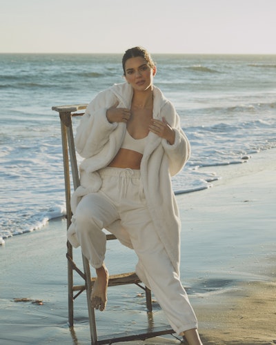 Kendall Jenner wears a long white sherpa coat from Alo Yoga in her latest campaign, released on Octo...