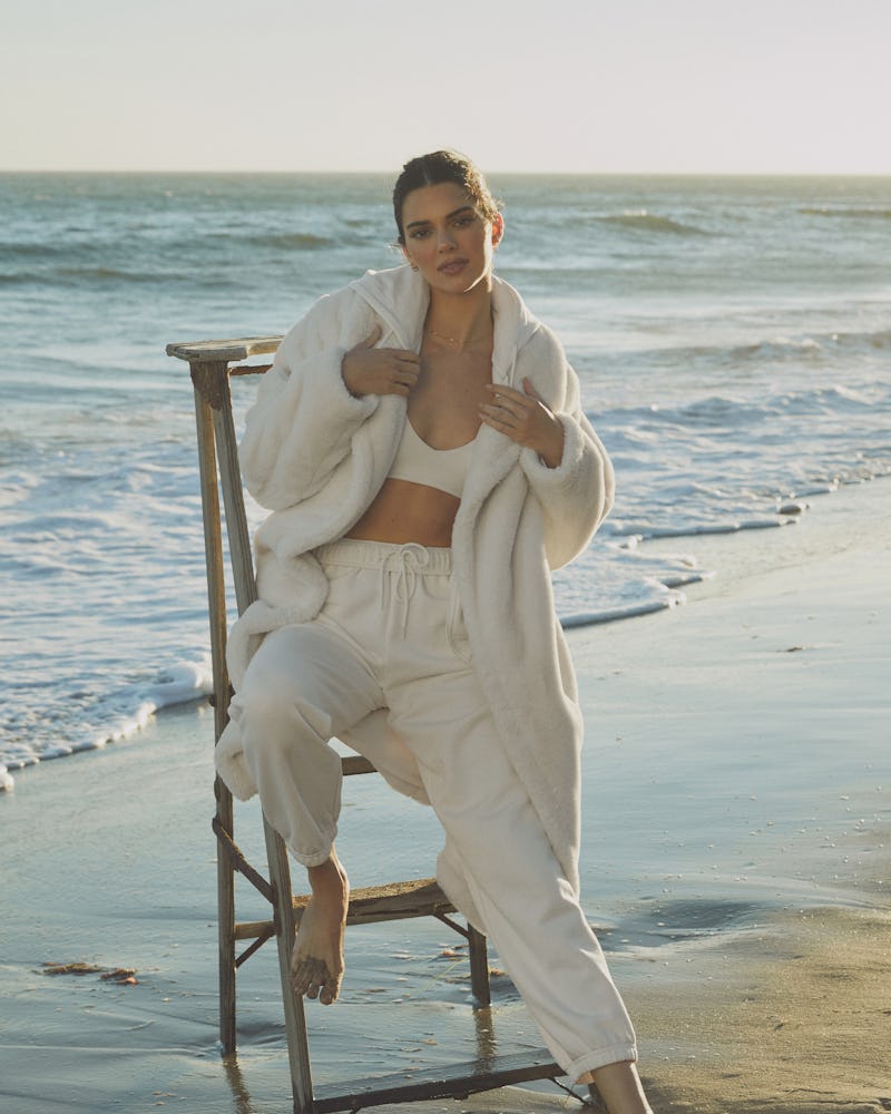 Kendall Jenner wears a long white sherpa coat from Alo Yoga in her latest campaign, released on Octo...