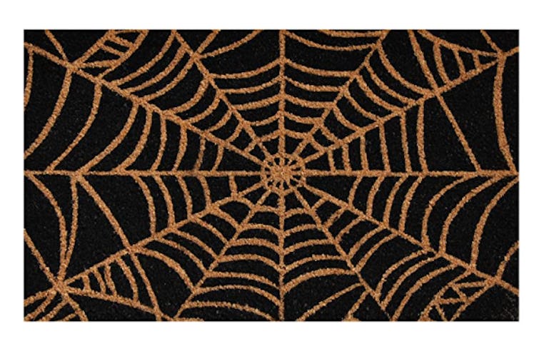 These Halloween doormats include a classic spiderweb design.