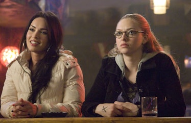 Megan Fox as Jennifer and Amanda Seyfried as Anita sitting side by side 