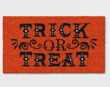 These Halloween doormats include a classic Trick-Or-Treat design.