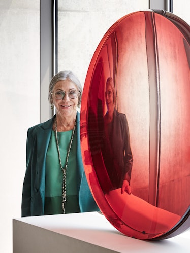 Alice Walton with Frederick Eversley’s "Big Red Lens," 1985.