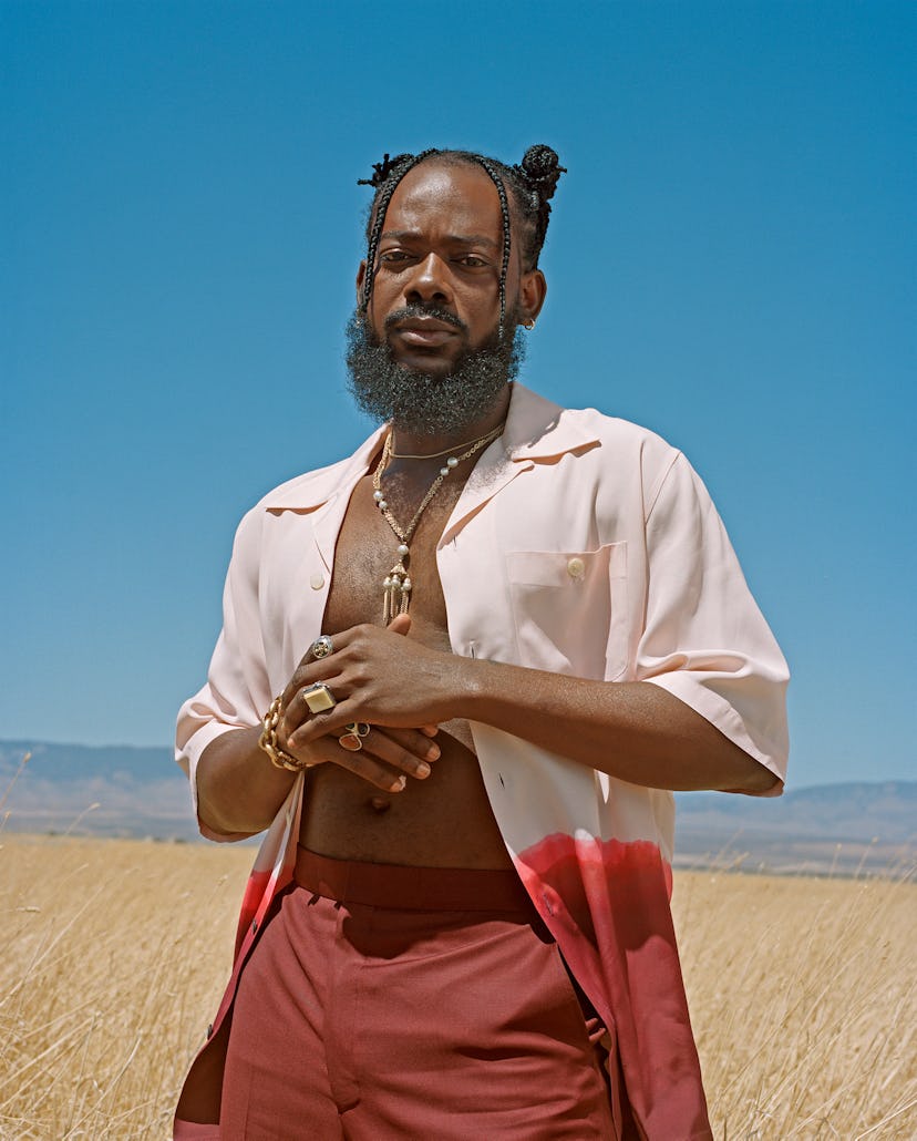 Adekunle Gold wears his own clothing and jewelry.