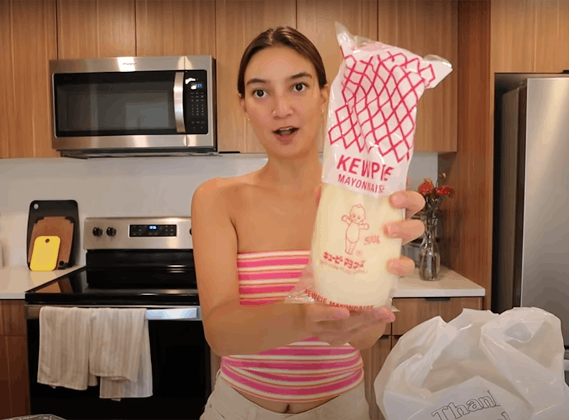 Emily Mariko holds up some Kewpie mayo, which she uses in Kewpie mayo recipes on TikTok like her vir...