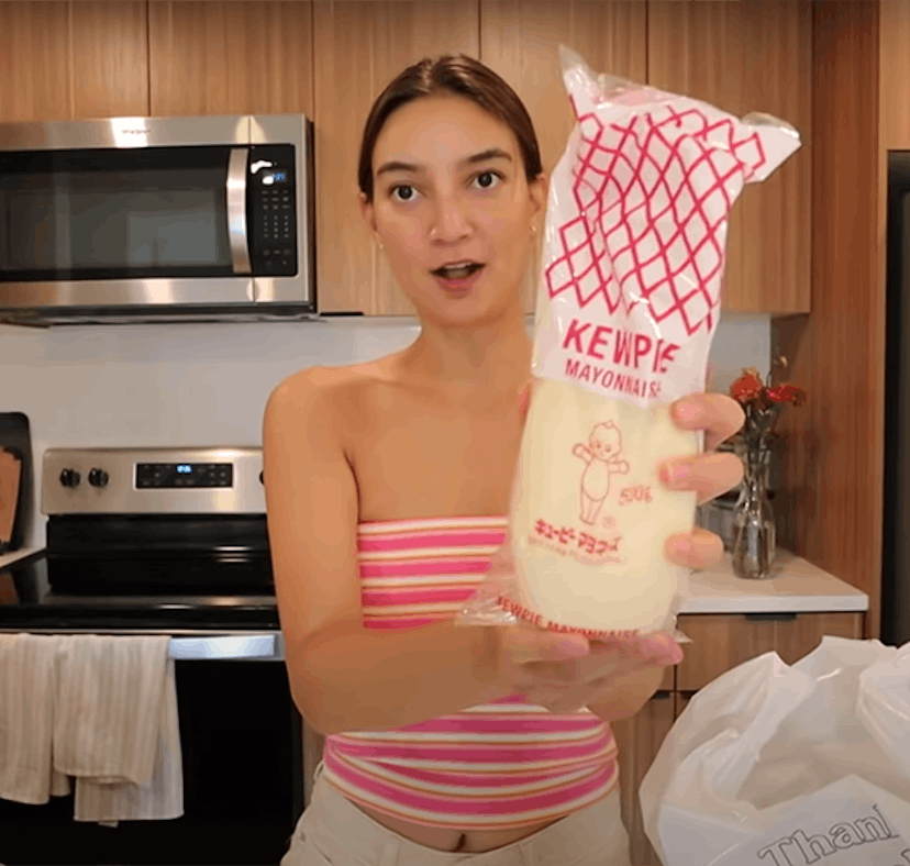 Emily Mariko holds up some Kewpie mayo, which she uses in Kewpie mayo recipes on TikTok like her vir...