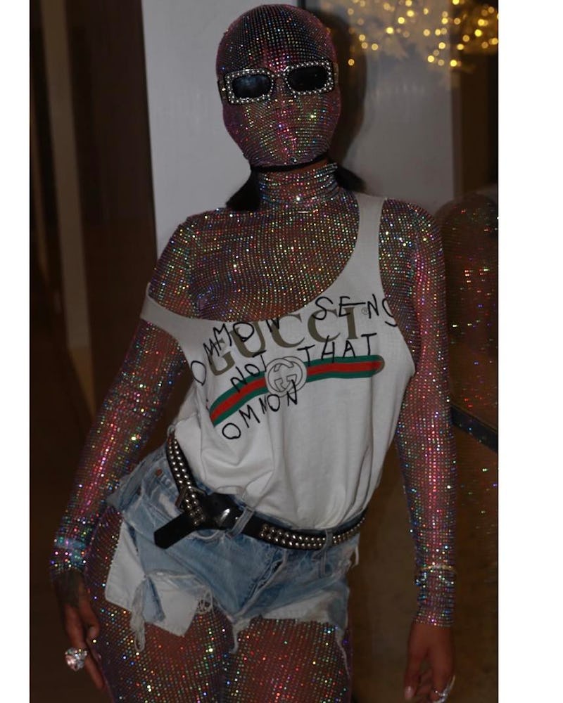 Rihanna in a Gucci glitter catsuit, tank top, and denim cutoffs.