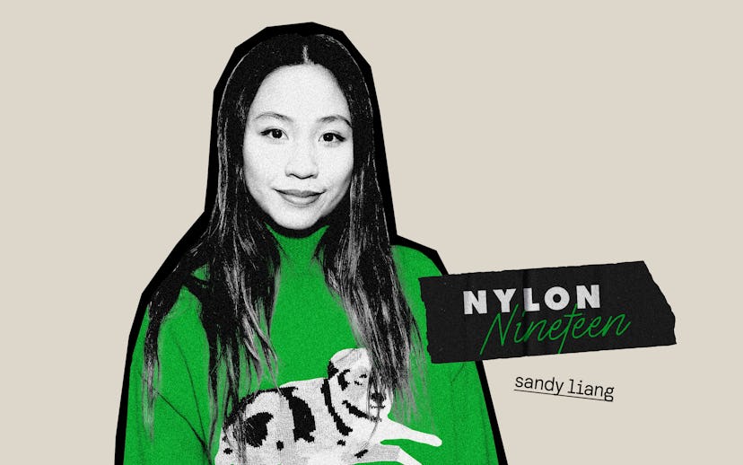Designer Sandy Liang in an accentuated green sweater with a dog on it