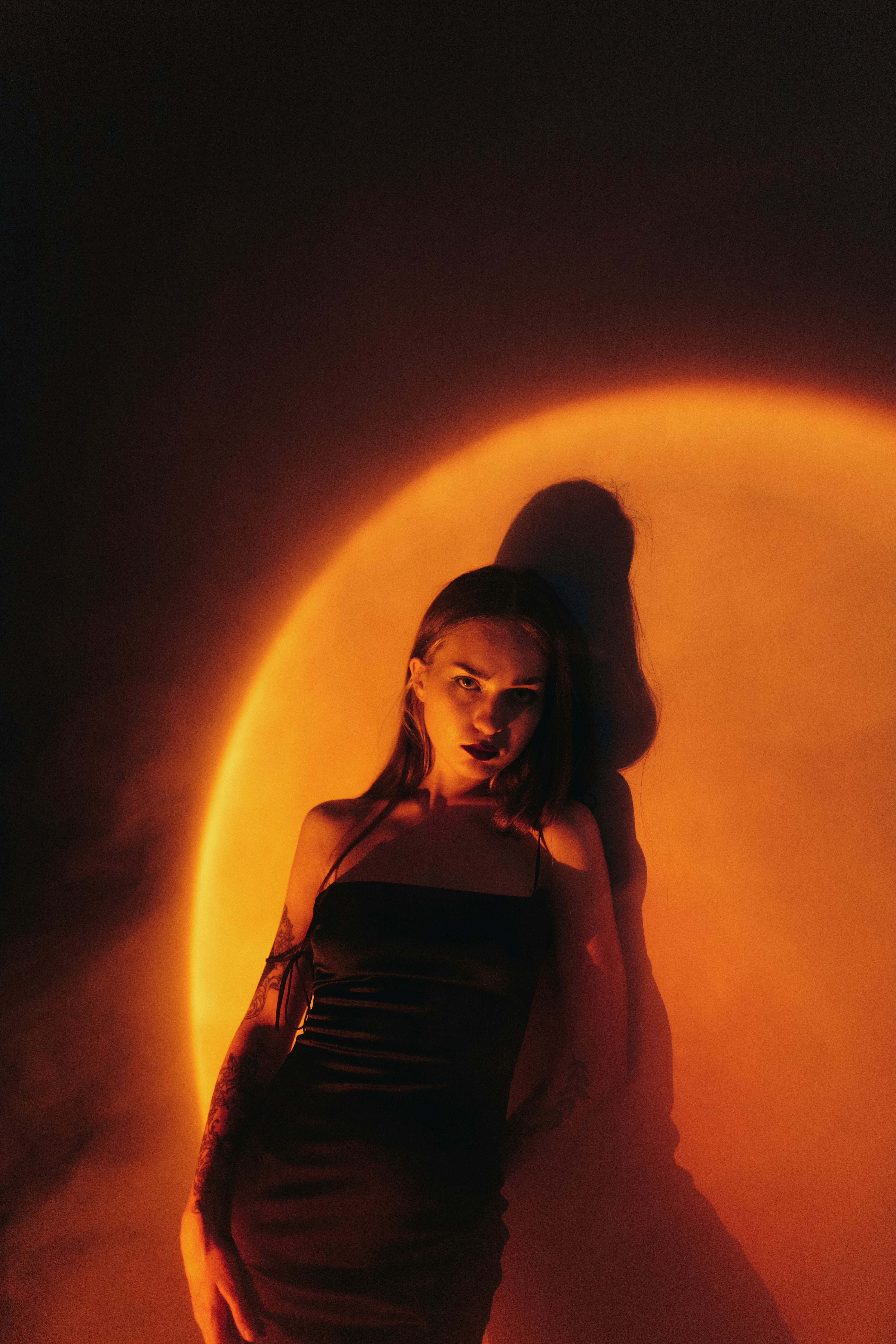Young woman in the light of the moon on Halloween 2021.