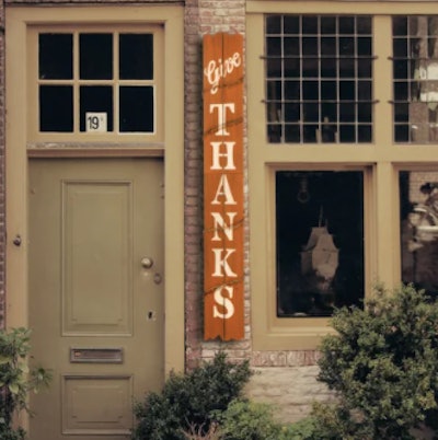 Wooden give thanks sign for porch