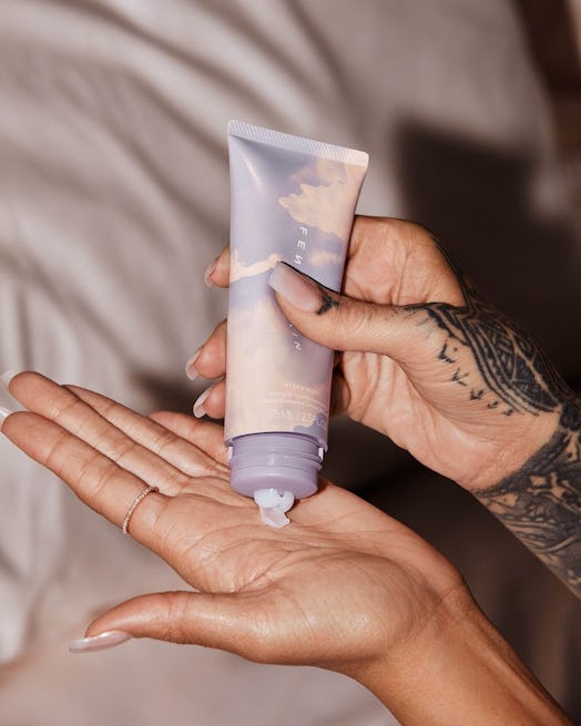 Rihanna applying Fenty Skin hand cream