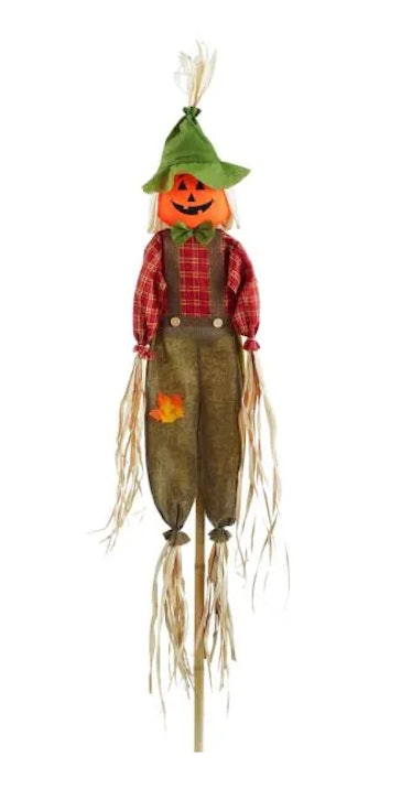 These Home Depot Halloween decorations include a pumpkin scarecrow.
