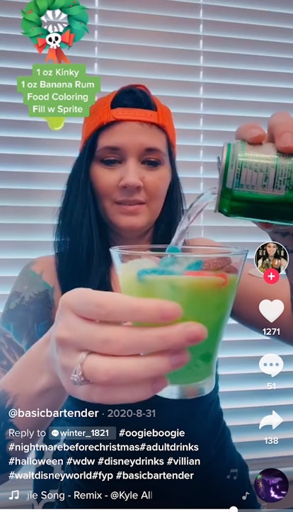 A woman makes an Oogie Boogie drink from 'The Nightmare Before Christmas' as part of TikTok drinks i...
