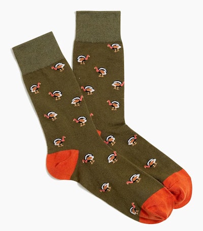 Image of a pair of adult olive-green socks with turkey print.