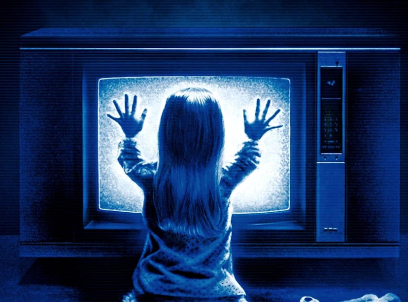 The cover of the 1982 horror film, 'Poltergeist', with Heather O'Rourke placing her hands on a telev...
