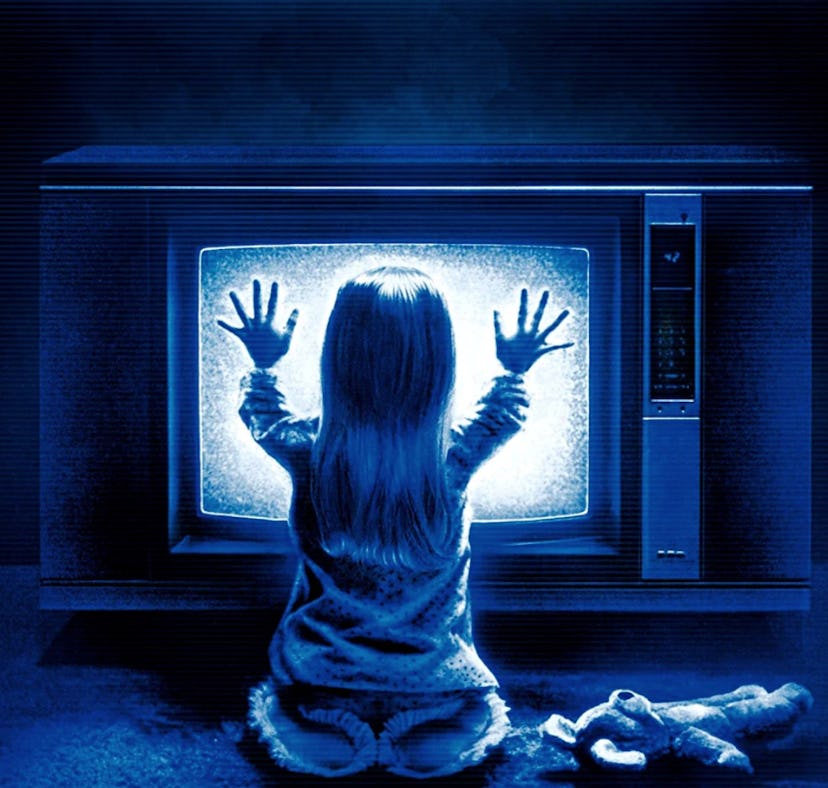 The cover of the 1982 horror film, 'Poltergeist', with Heather O'Rourke placing her hands on a telev...