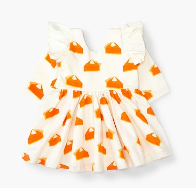 Image of a toddler-size white dress with an orange pumpkin-pie print.