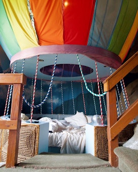 A bed in the shape of a hot air balloon at a hotel 