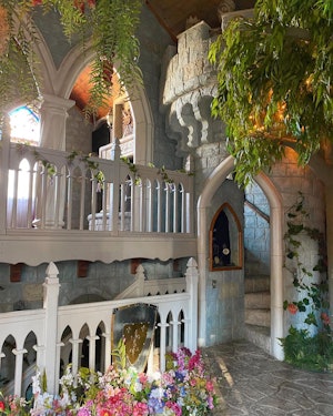 A staircase shaped like the entrance to a castle in a hotel
