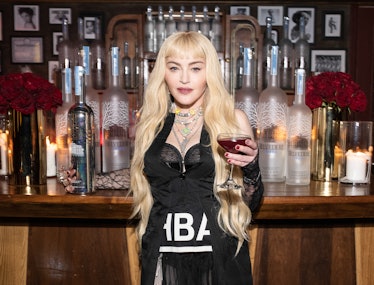 Madonna holding a vodka drink. 