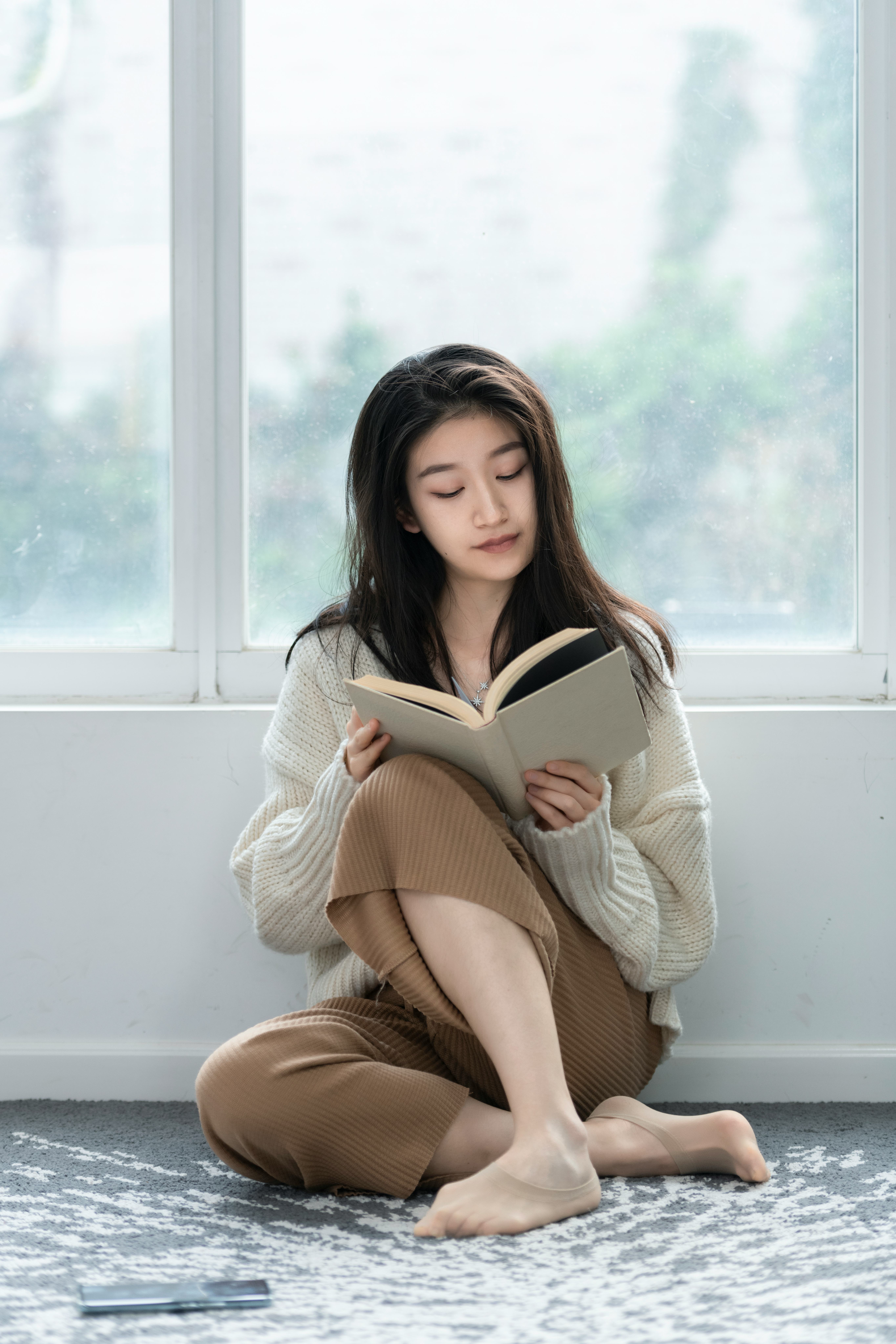 A woman reads a book.