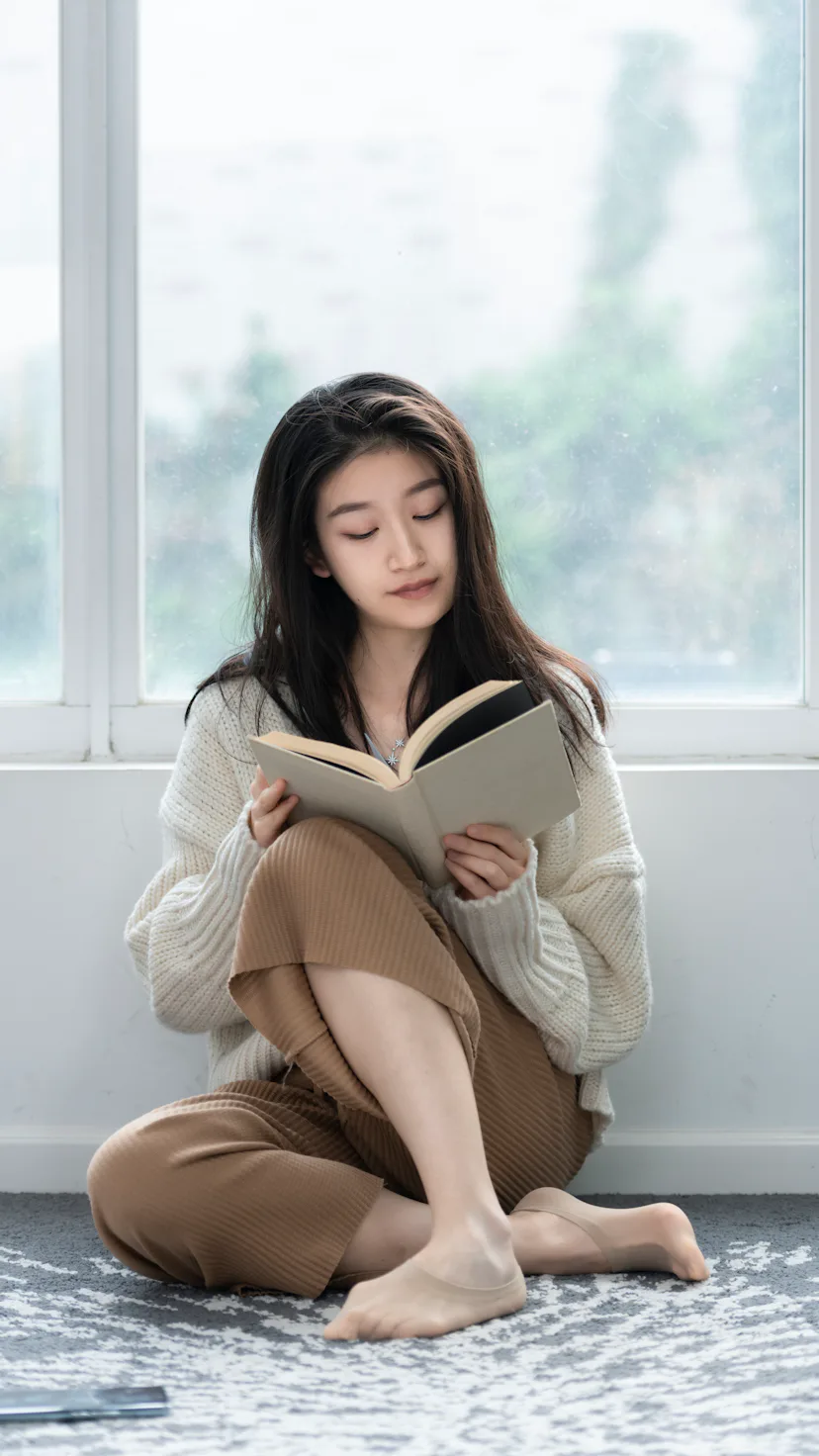 A woman reads a book.
