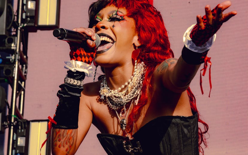 Rico Nasty performing in a clown-like Halloween costume