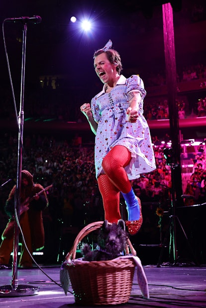 Harry Styles performs in a Dorothy from 'The Wizard of Oz' Halloween costume.