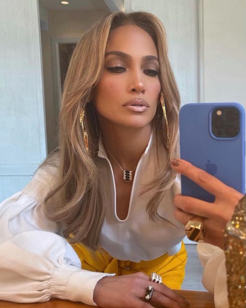 Jennifer Lopez with purple iPhone taking mirror selfie