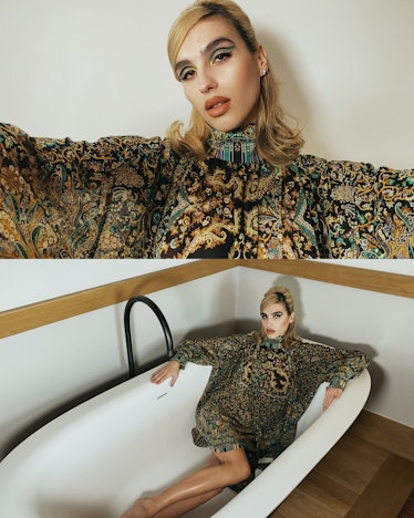 Maxin Magnus in an Etro X Harris Reed oversized dress posing in a bathtub 