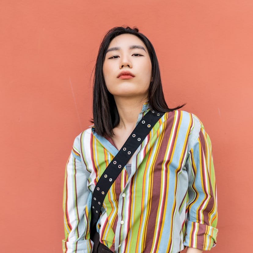 Young woman with a striped shirt, having the worst week of November 29, 2021, per her unlucky zodiac...