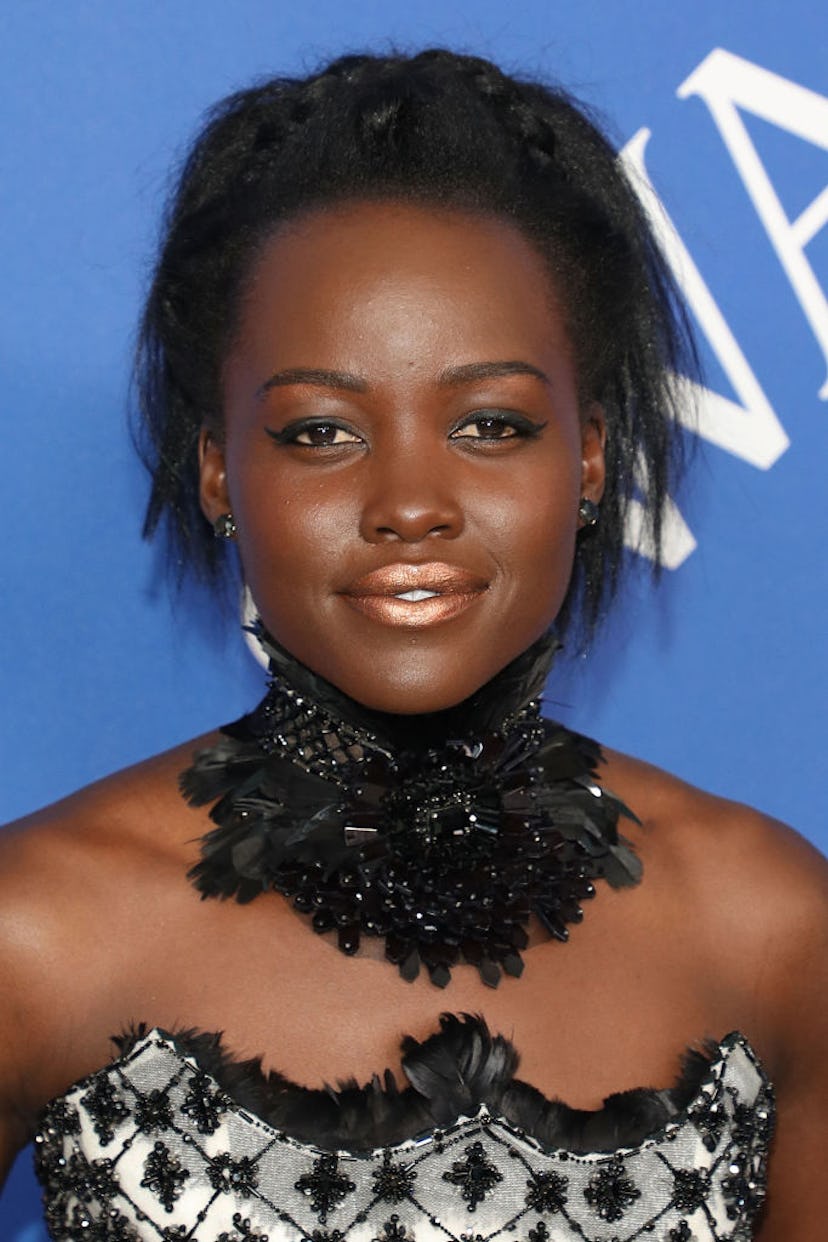 Lupita Nyong’o wore a metallic gold lip to the 2018 CFDA Awards.