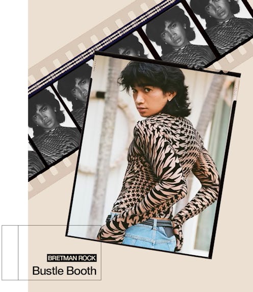 Bretman Rock posing in a leopard inspired shirt