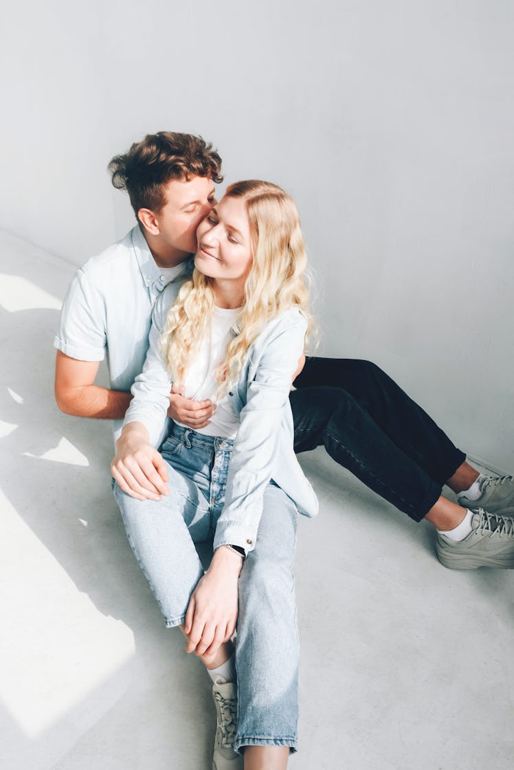 Young couple kissing during Venus retrograde 2021, which will affect every zodiac sign's love life.