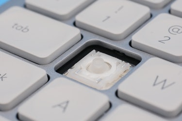 A close-up of the scissor switches in the Logitech MX Keys Mini keyboard.