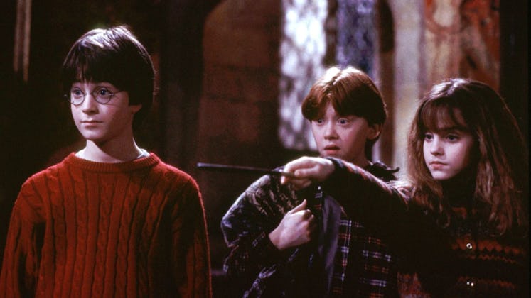 Daniel Radcliffe, Rupert Grint, and Emma Watson star as Harry, Ron, and Hermione in Harry Potter and...