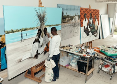 Peter Uka painting in his studio in Cologne, Germany.