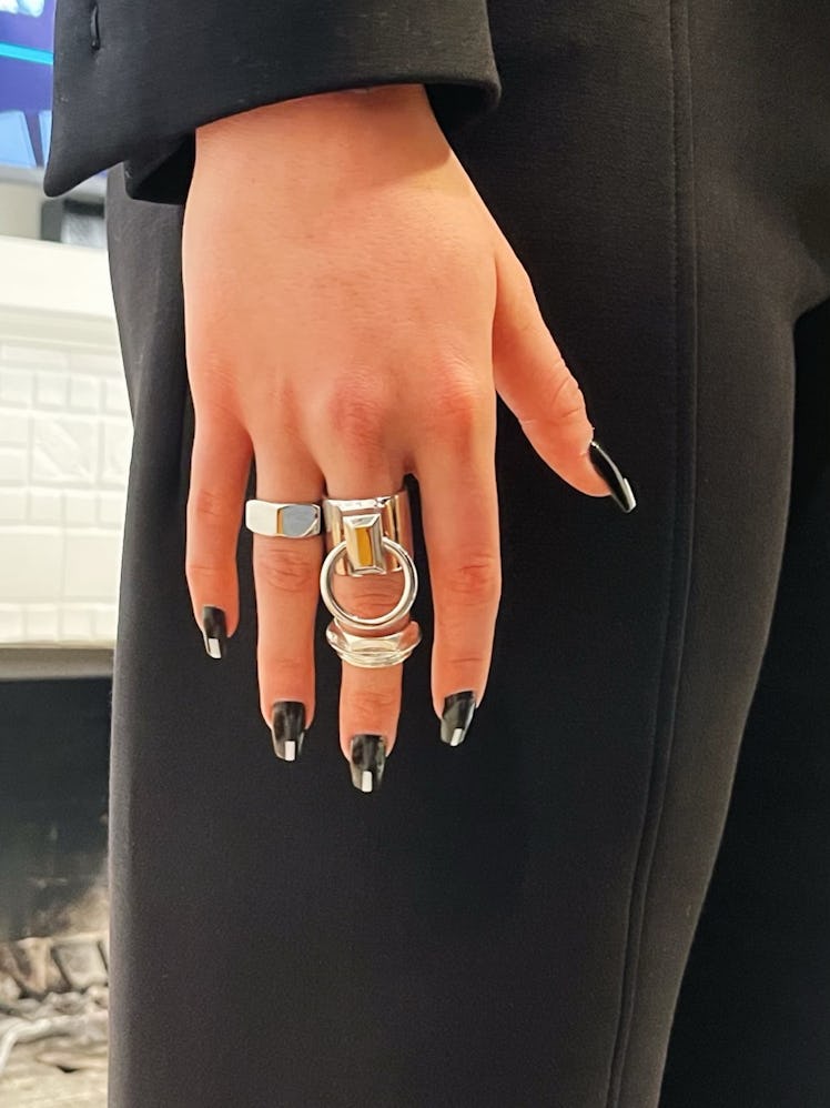 Close-up of Renée Rapp's nails and silver rings
