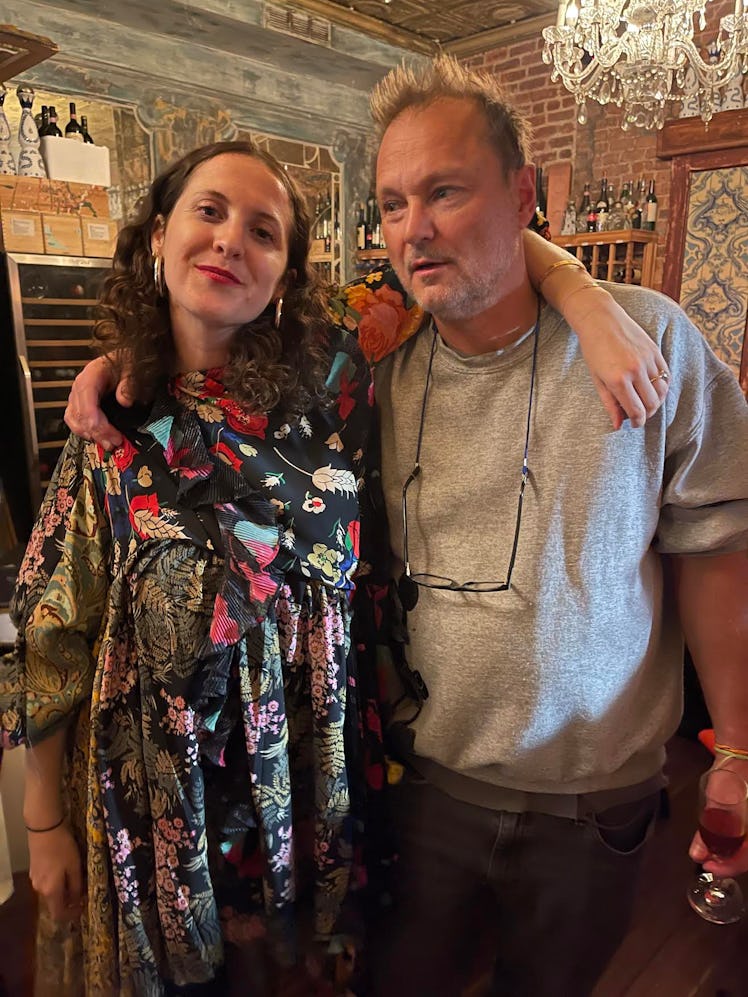 Sara Moonves and Juergen Teller posing hugged at a restaurant 