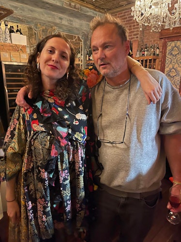 Sara Moonves and Juergen Teller posing hugged at a restaurant 