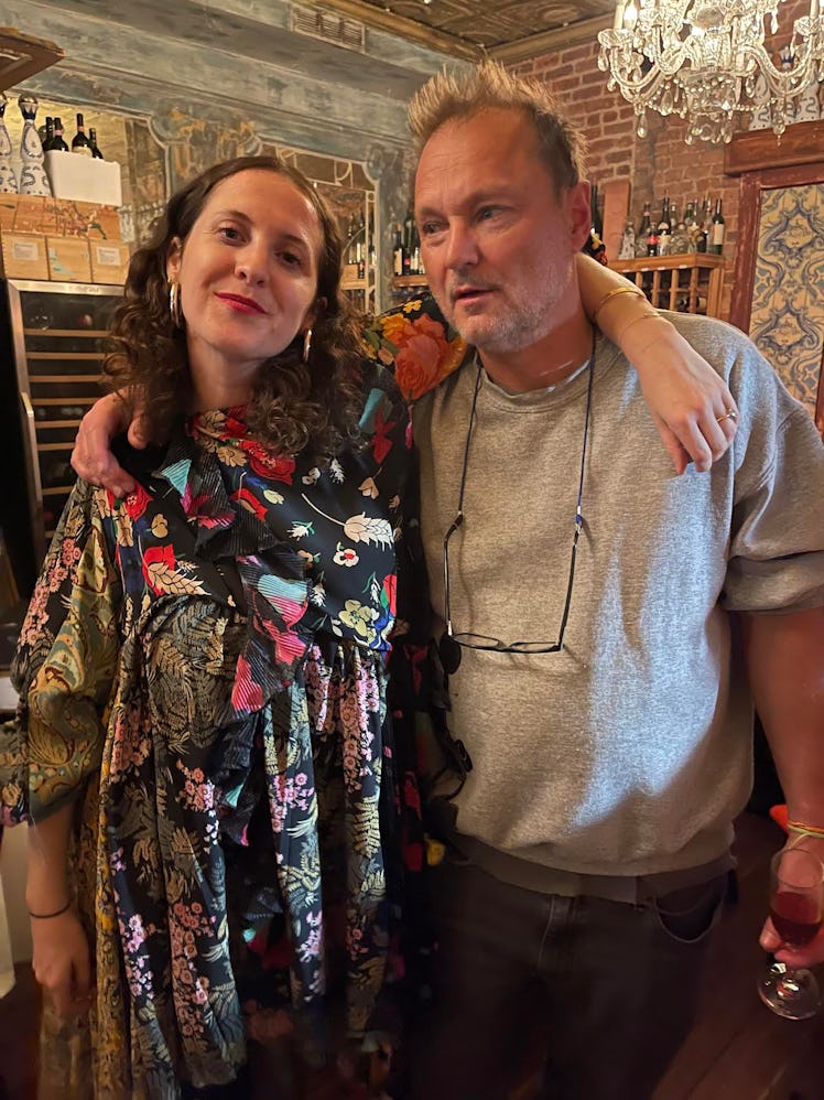 Sara Moonves and Juergen Teller posing hugged at a restaurant 