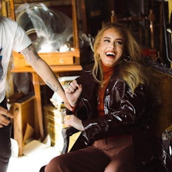 Adele laughing in behind-the-scenes photo