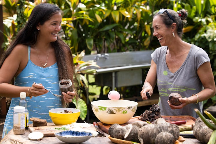 Mochi travels to Hawaii in the New Waffles + Mochi holiday special, preparing a meal with two women.